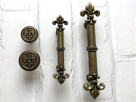 Fleur De Lis Handle .